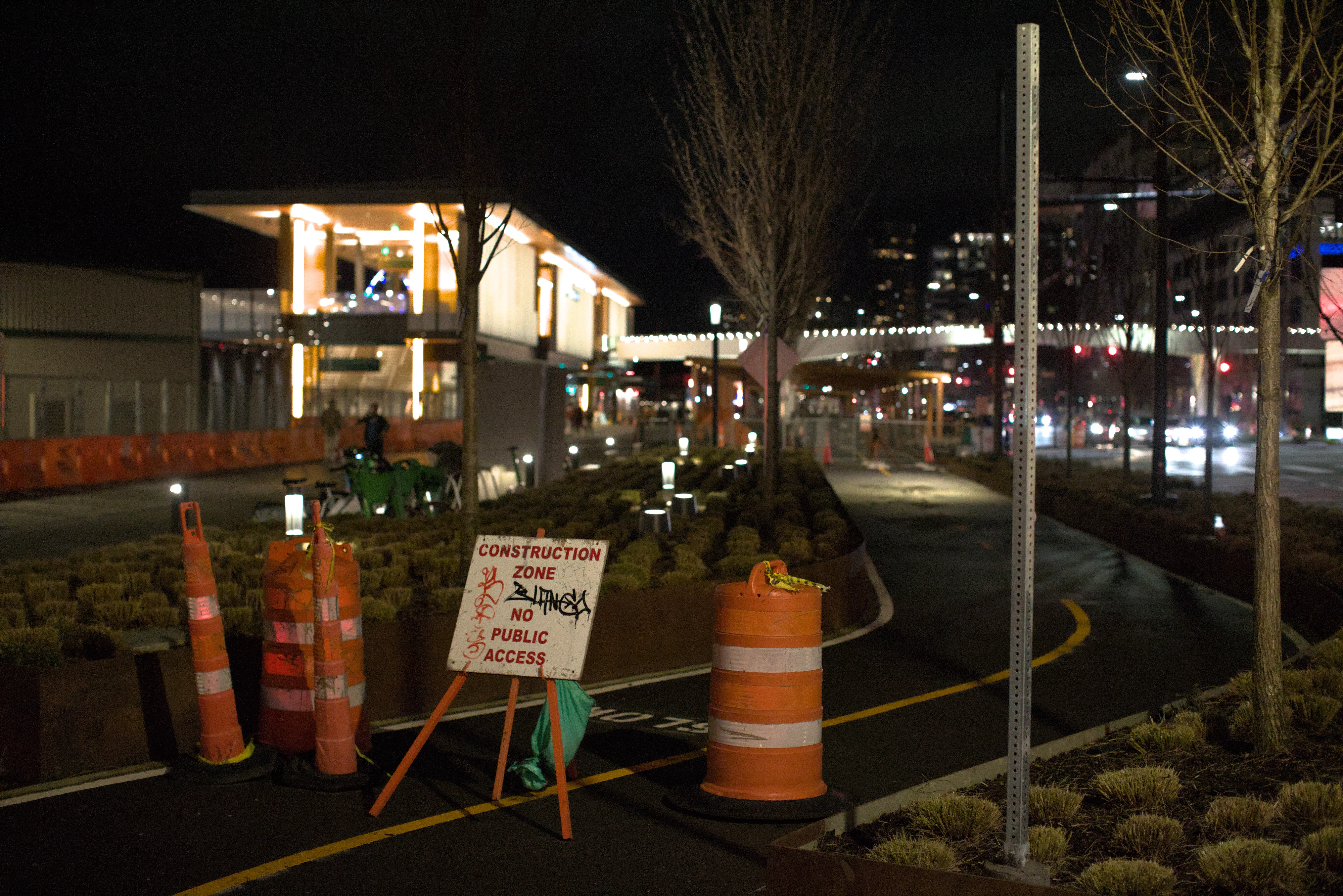 A construction blocks the bike path in front of the Seattle Ferry Terminal
