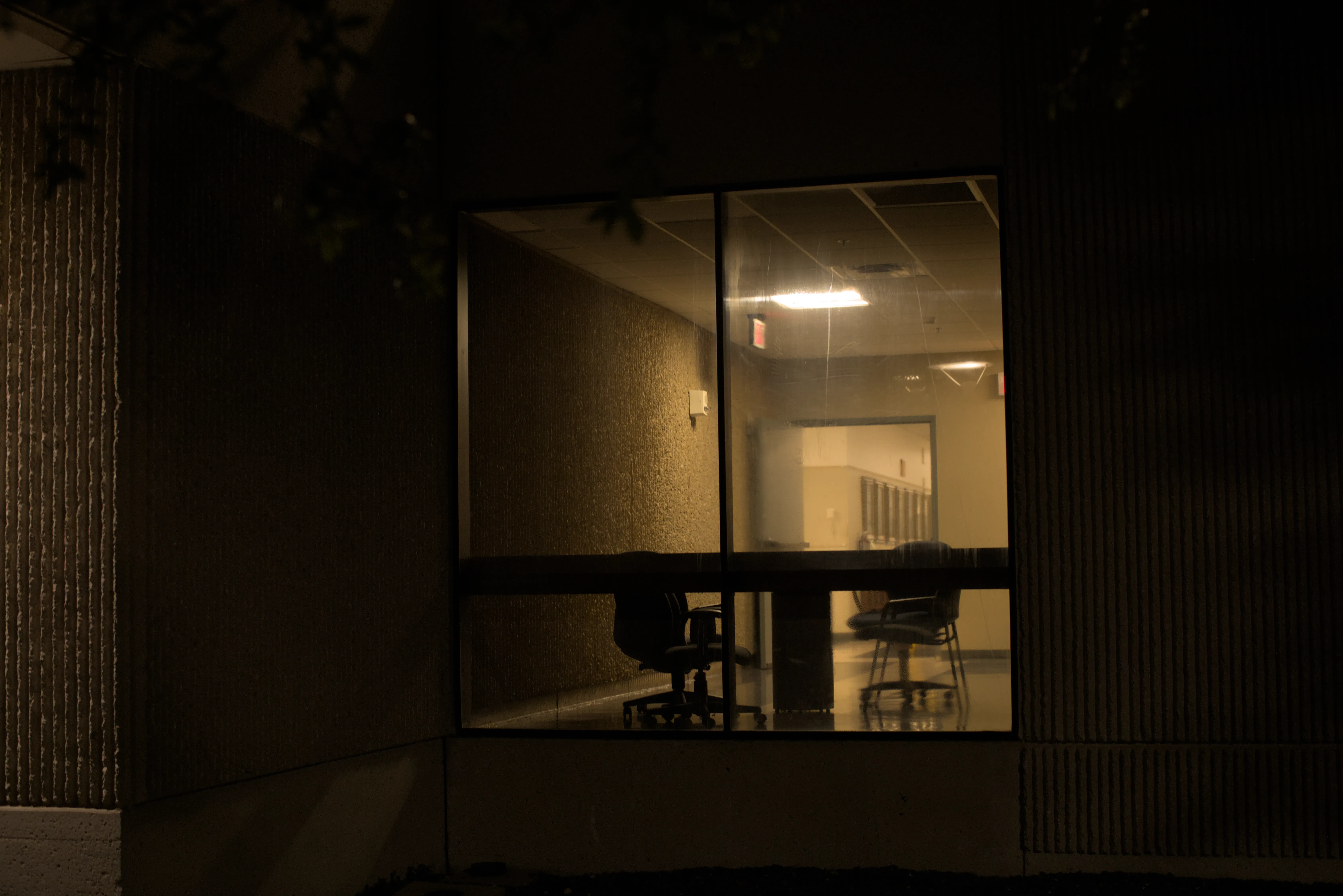 Lights on in the halls of an empty UTD building