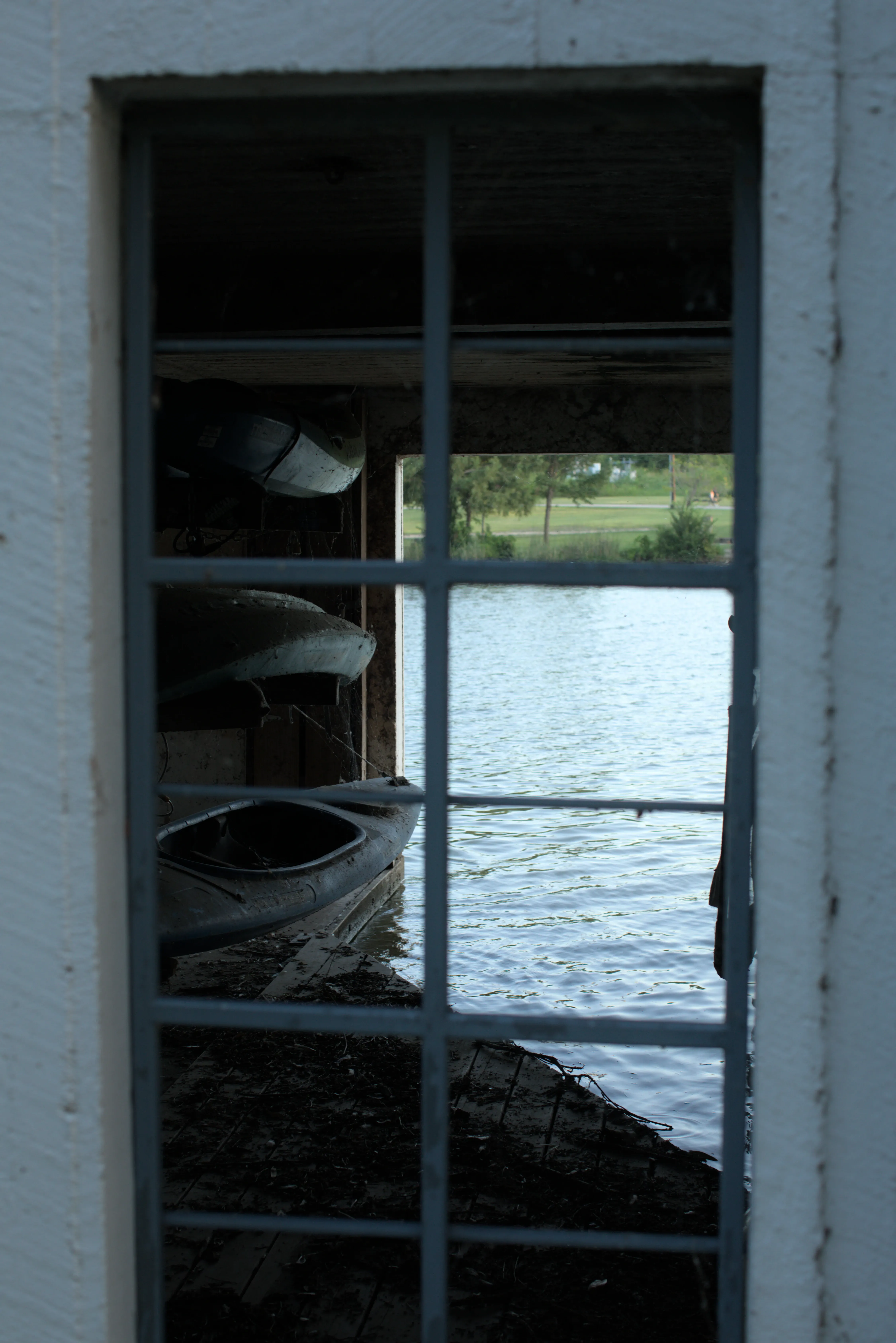 Dirty kayaks in a White Rock Lake boat house