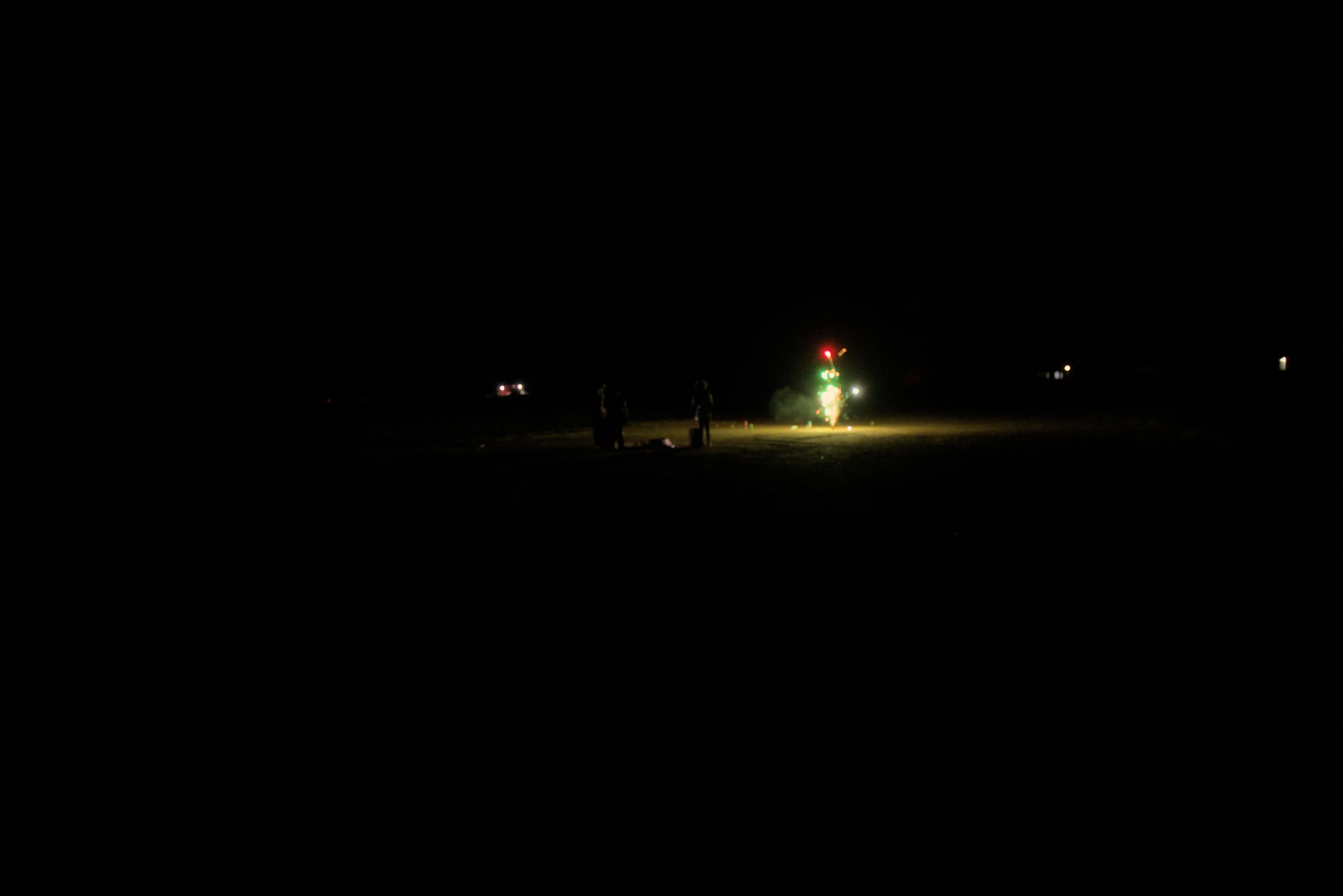 Kids lighting off fireworks at Cadillac Ranch