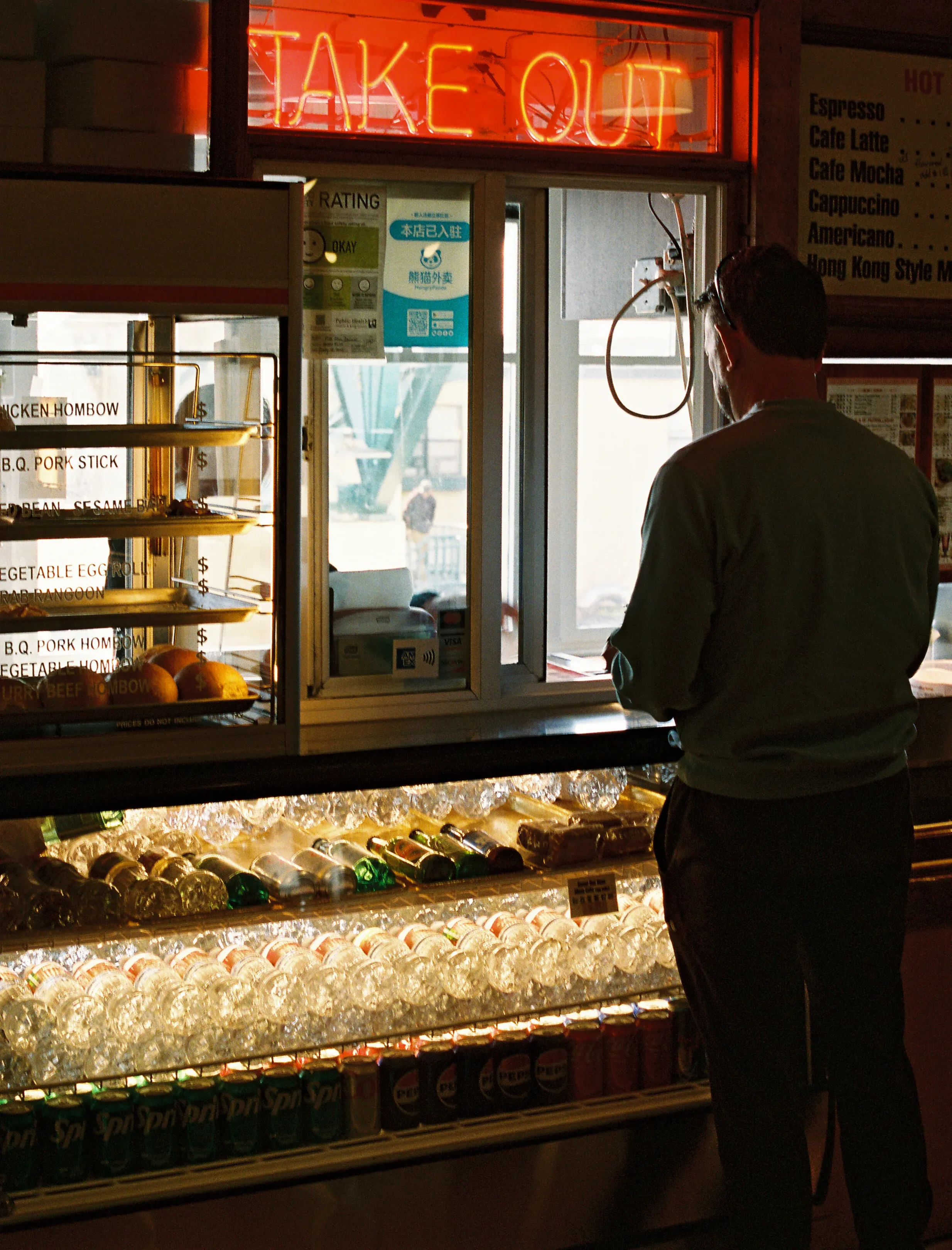 A man orders take out from Pike Place Chinese Cuisine