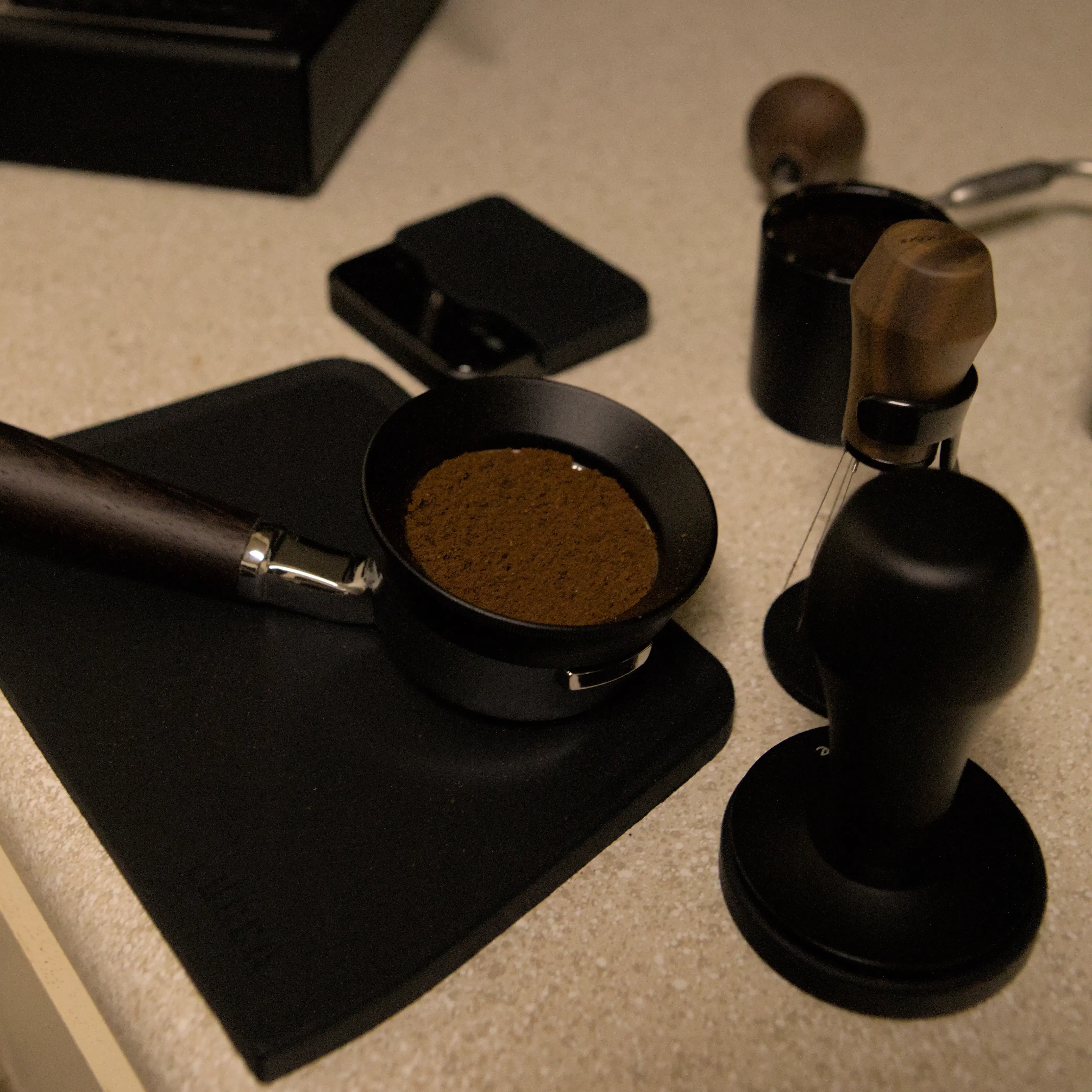 Portafilter with ground coffee after WDT