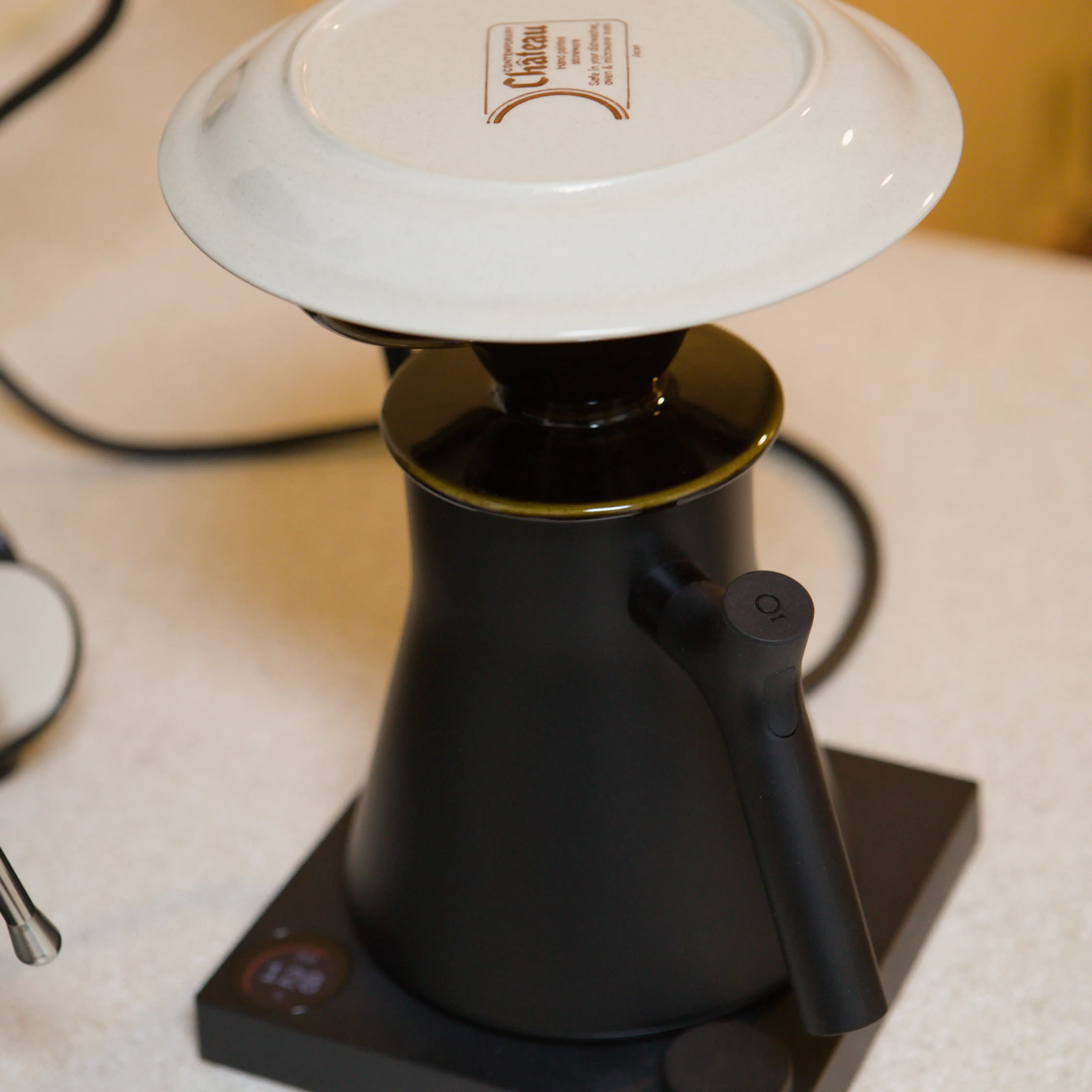 Kettle with a V60 preheating on top